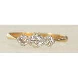 An 18ct gold and platinum vintage ladies ring by T&B. The stones approx 20pnts. Size M / Weight 1.