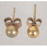 A pair of 9ct gold ball stud earrings with post backs. Marked 375 tests 9ct.