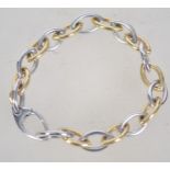 A hallmarked 9ct white and yellow gold bracelet of oval link form by Italian designer Bassi.