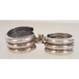 A pair of silver hoop earrings with post backs. Measures 1.5cms. Tests silver.