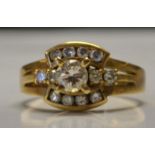 An 750 gold and diamond ring set with central 20pt diamonds total approx 40pts. Marked 750.