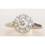 A ladies 18ct gold and platinum diamond cluster ring.