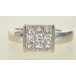 A hallmarked 18ct white gold and diamond cluster and pave set ring, inset 9 stones total half carat.