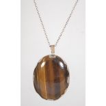 A hallmarked 925 silver and tigers eye pendant necklace.