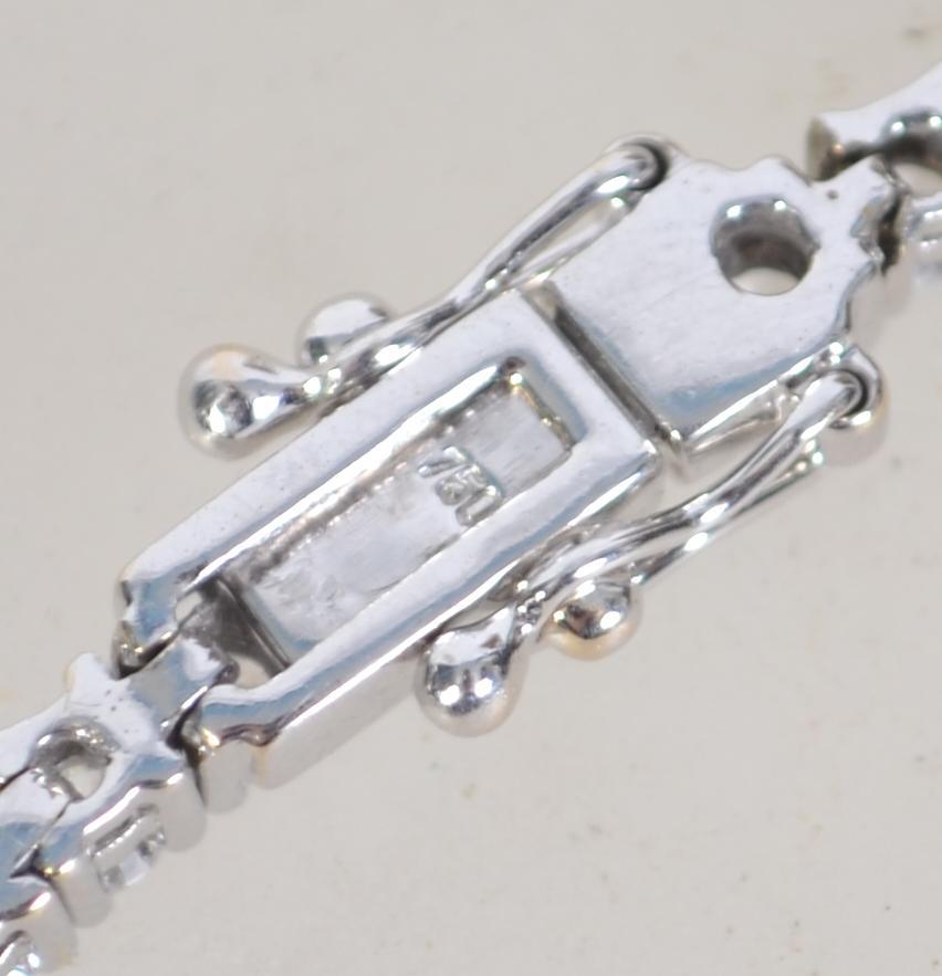 A hallmarked 18ct white gold and diamond tennis bracelet set with a total of 3cts diamonds. - Image 8 of 8