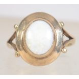 A hallmarked 9ct gold and opal ring. Hallmarked for London 1977. Size O.5.