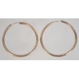 A pair of 9ct gold large hoop earrings with textured decoration. Measures diameter 3.5cms.