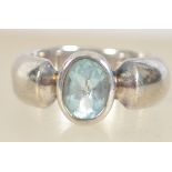 A silver 925 ladies dress ring with central bezel set pale blue topaz stone. Ring size L.5 weighs 8.