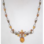 A 925 silver Art Nouveau style amber cabochon festoon necklace. Marked 925. Measures 16 inches.