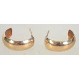 A pair of 9ct gold hoop earrings with post backs. Marked 375 to body, tests 9ct gold. Measures 1.