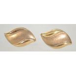 A pair of 9ct marked ladies gold earrings in the form of leaves having post backs.