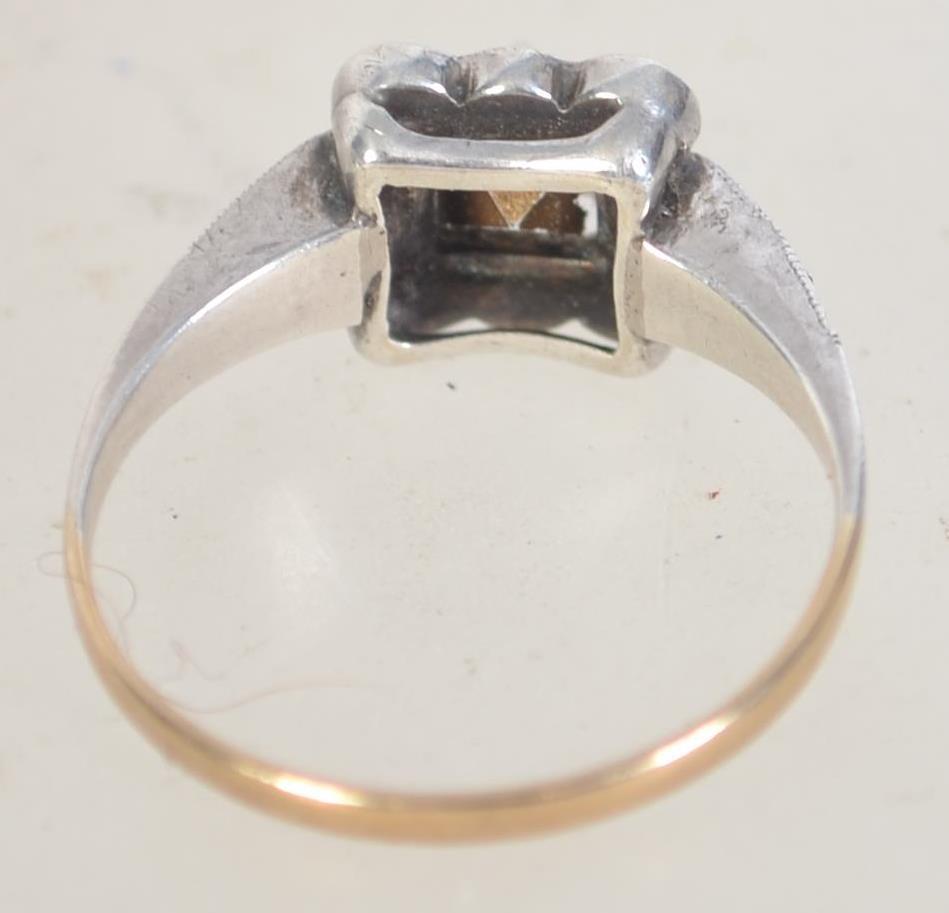 An Art Deco 9ct gold and silver ring with paste stones. Marked 9ct and Sil. Tests 9ct and silver. - Image 2 of 3