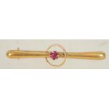 A Edwardian 9ct gold bar brooch with circle and central set stone with c clasp.