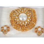 A vintage Sphinx rhinestone and pearl set bracelet, earring and brooch suite. Signed Sphinx. boxed.