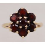 A 9ct gold garnet set ring. Hallmarked London. Size P. Weight 3.3g.