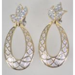 A pair of large silver and gold tone clip on earrings in the form of stylized pineapples studded