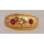 An early 20th century 18ct gold ring with rubies and diamonds in a star setting.