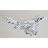 A vintage Sarah Coventry silver tone figural brooch in the form of a Wren bird with red rhinestone