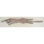 A vintage silver tone large rhinestone set panther shoulder brooch. Measures approx 7.5 inches.