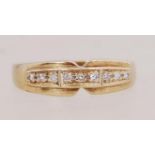 A 9ct gold and diamond ring. Hallmarked London import. Size N.