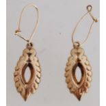 A pair of 9ct gold drop earrings. Hallmarks worn. Tests 9ct gold..