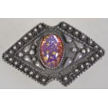 An early 20th century Egyptian silver brooch pin with foil glass cabochon and c clasp.