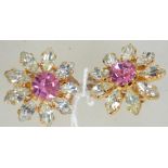 A pair of vintage gold tone rhinestone flower clip on earrings. Measures approx 3cms.