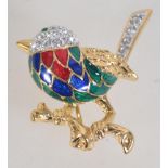 A 1970s Attwood and Sawyer enamel and Swarovski crystal brooch with roller clip clasp in original