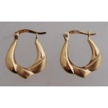 A pair of 14ct gold creole earrings with leaver catch. Marked ARR 14K. tests 14ct gold. Weight 1.3g.