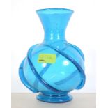 An Islamic blue glass vase with embellis