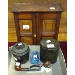 A mahogany two-door smoker's cabinet, 28cm wide, 30cm high, a Bakelite tobacco jar and cover, one