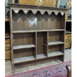 A grained wood dresser top fitted with shelves, 134cm wide, 136cm high.
