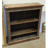 A low oak open bookcase with adjustable shelves, 84cm high, 76cm wide.