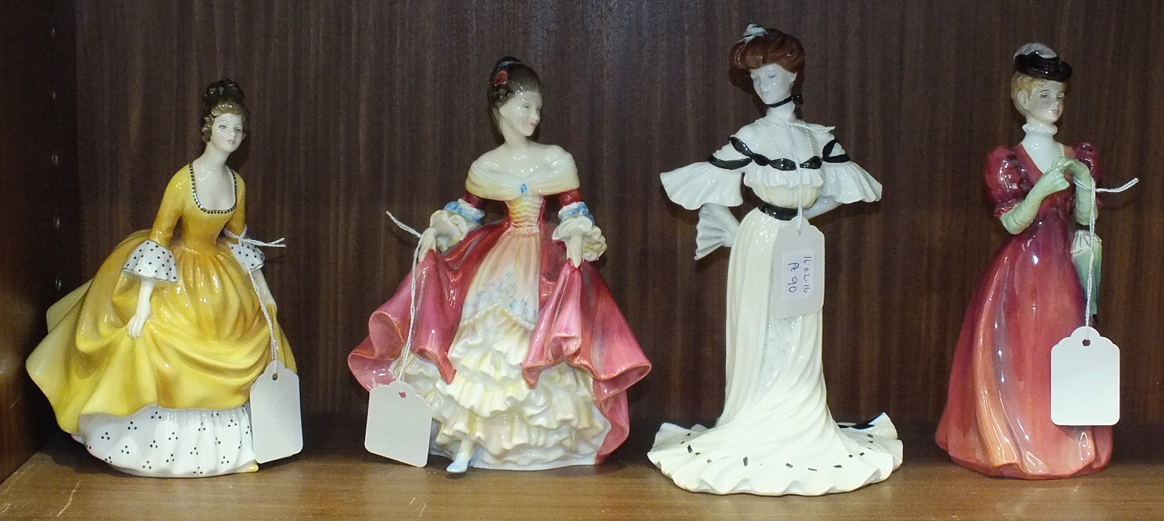 Two Royal Doulton figurines, 'Coralie' HN2307, 19cm high, 'Southern Belle' HN2229, 20cm high, a