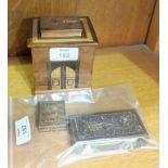 A Tunbridgeware stamp box, 4 x 4cm, another wooden stamp box and an inlaid wood puzzle money box