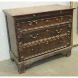 A 19th century oak chest, the rectangular top above a shelf and three graduated drawers, on