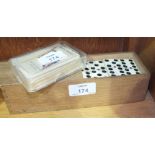 A set of ivory and ebony-backed dominoes to double-six, in box, each domino 5.5 x 2.5cm and a