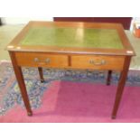 A mahogany writing table, the rectangular top above two drawers, on square tapering legs, 91cm