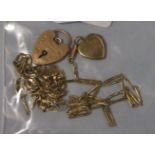 A 9ct gold padlock clasp, a quantity of gold chains and a small gold locket, 9g.