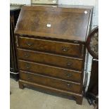 A walnut bureau, the fall front above four drawers, on bracket feet, 76cm wide.