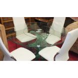 A Furniture Italia 'Twirl' contemporary glass-top dining table, the circular top raised on spiral