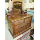 A late-Victorian mahogany dressing chest, the mirrored superstructure fitted with two small