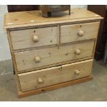 A stripped pine rectangular chest of two short and two long drawers, 90cm wide.