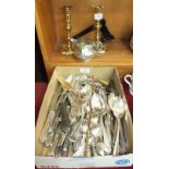 A part-canteen of Pinder Bros cutlery, a plated jug and a pair of brass candlesticks.