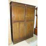 An 'Awlyn' mahogany gentleman's compactum wardrobe with fitted interior, 137cm wide, 191cm high.