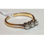 A diamond ring, claw set three old cut diamonds in 18ct gold and platinum mount, size P, 2.1g