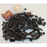 A quantity of graduated Bakelite beads, facetted glass beads and jet-type beads.