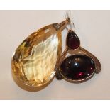 A 9ct gold mounted pendant collet set pendeloque and oval garnets and a large facetted tear drop