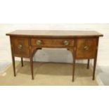 A George III mahogany bow-fronted sideboard, the top above two cupboards and a central drawer,