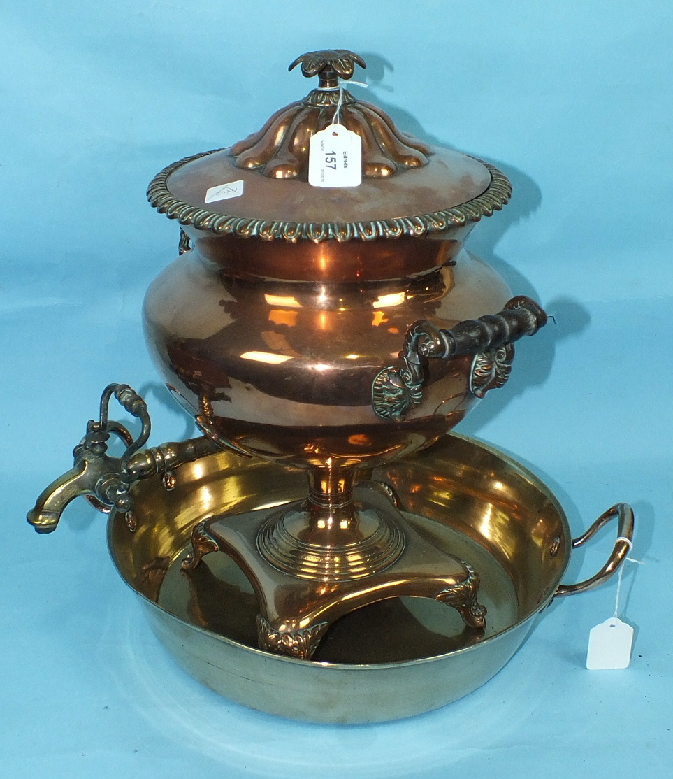 A 19th century copper samovar with wood handles and bronze tap, 43cm high and a brass two-handled